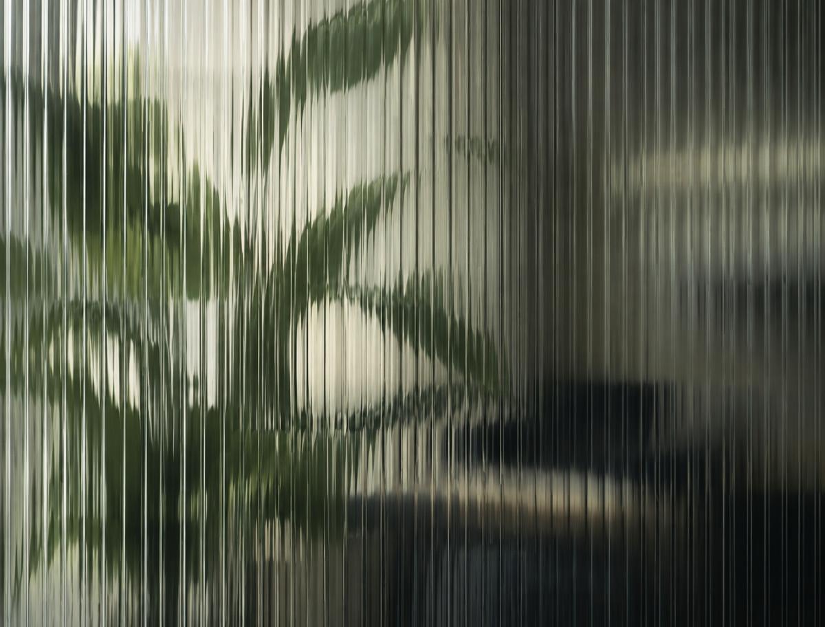 Plant seen through fluted glass
